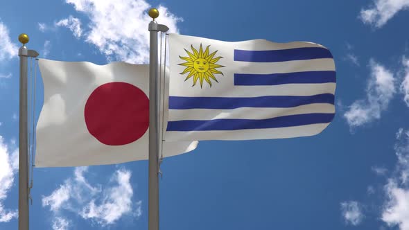 Japan Flag Vs Uruguay Flag On Flagpole