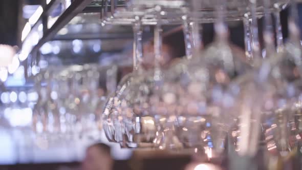 Wine Glasses Hanging in Bar