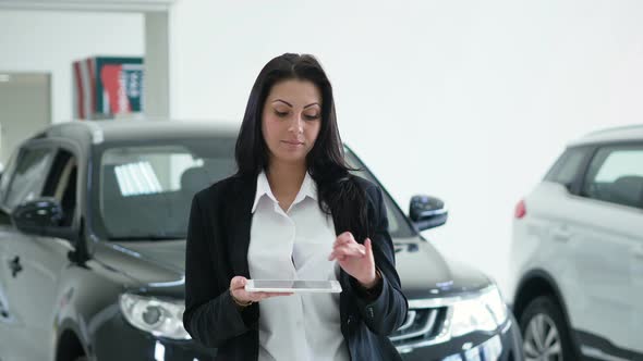 Attractive Elegant Business Lady Using Laptop with a Graphic Image of the Inscription SMART CAR