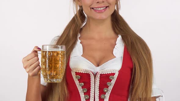 Gorgeous Oktoberfest Woman in Sexy Dirndl Dress Holding Beer Showing Thumbs Up