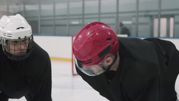 Hockey Coach Giving Instructions To Players