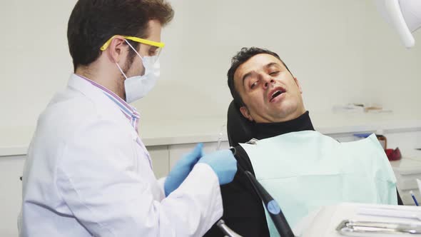 Mature Man Visiting His Dentist at the Clinic