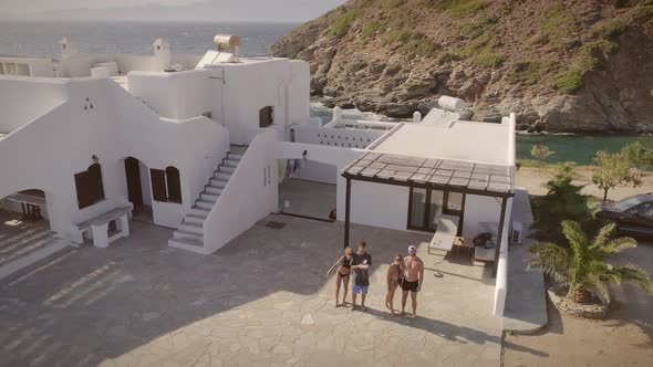 Aerial view of group of friends enjoying a summer day on the beach in Greece.