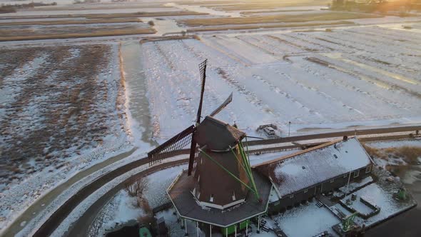 Zaanse Schans Windmill Village During Winter with Snowy Landscape Snow Covered Wooden Historical