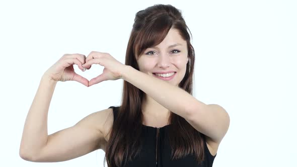 Heart Sign by Young Girl in Love, White Background