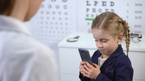 Optician Trying to Take Cellphone From Naughty Child, Video Games Damage Sight