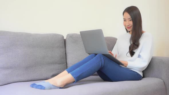 Young asian woman use laptop