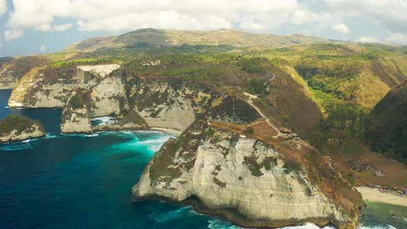 Atuh Beach on Nusa Penida Island with a Lone Cliff Top House in Bali, Indonesia. Aerial View 