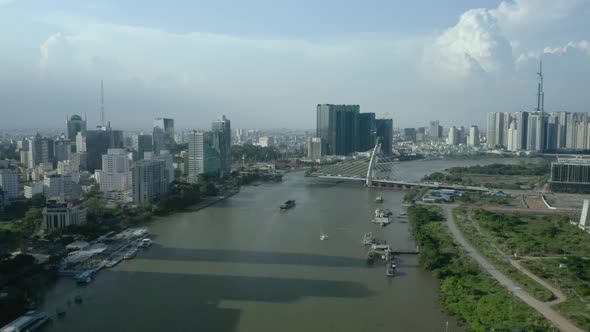 Saigon river waterfront with long afternoon shadows from the  Ho Chi Minh City skyline, a symbol of