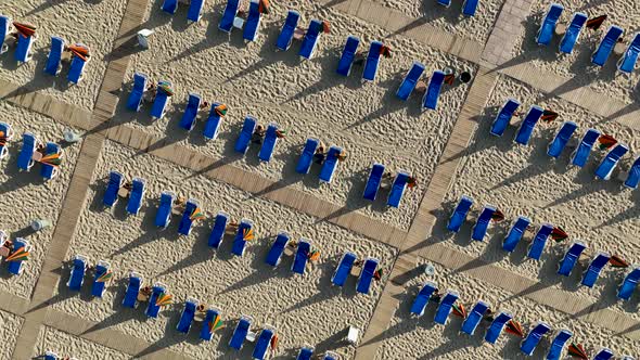 Empty sun loungers on the beach aerial view 4 K Turkey Alanya