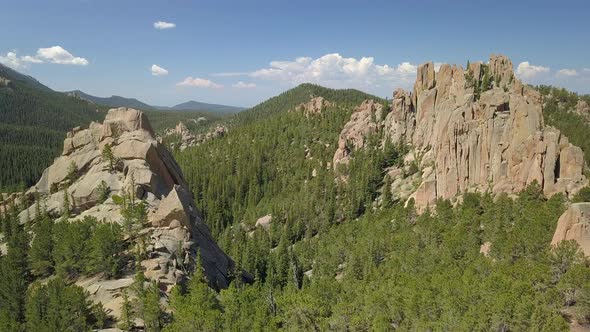 Aerial View Flying Through the Jagged Rocky Peaks of the Crags in Colorado