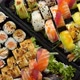 Close Up of Various Sushi Set in Black Plastic Delivery Box - VideoHive Item for Sale