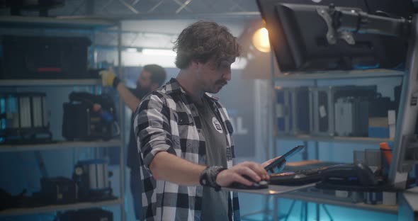 Clerk Smiling in Video Equipment Store