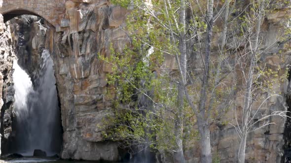 Panning along beautiful man-made waterfalls at a park or garden