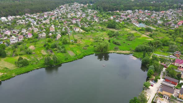 Aerial View of Village on a Bank of the Lake.