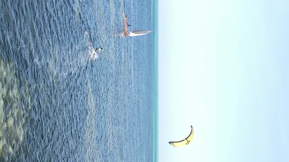 Vertical Video Kitesurfing Near the Shore of Zanzibar Tanzania Aerial View