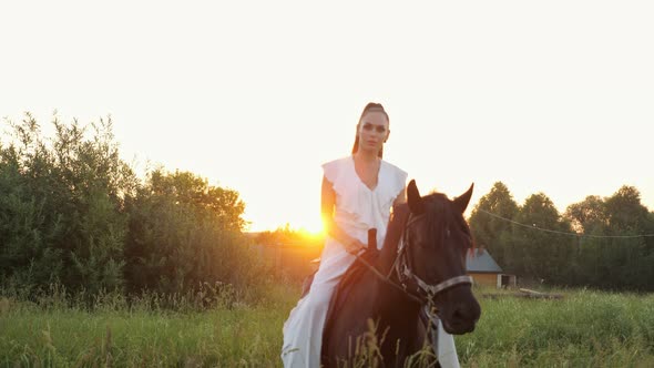 Professional Model Brunette Rider in Dress Rides Stallion