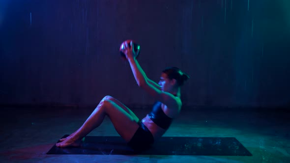 Woman Doing Core Exercise on Mat Rain