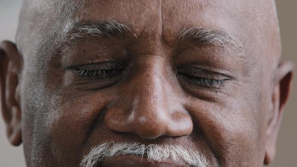Closeup African Old Male Eyes Looking at Camera Biracial Mature Elderly Senior Man Suffering From