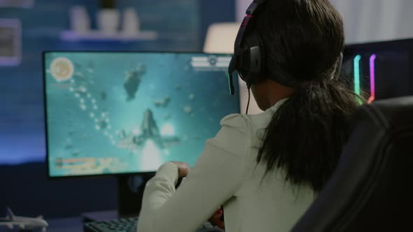 Closeup of Competitive Black Woman Player Holding Joystick Playing Space Shooter