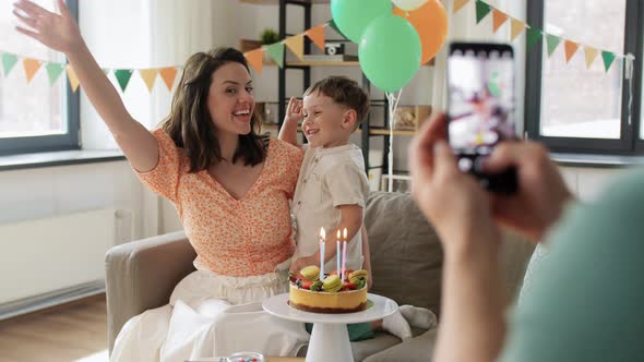 Family with Birthday Cake Photographing at Home