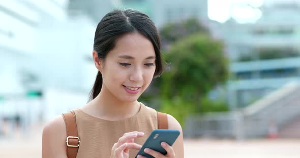 Woman use of mobile phone online