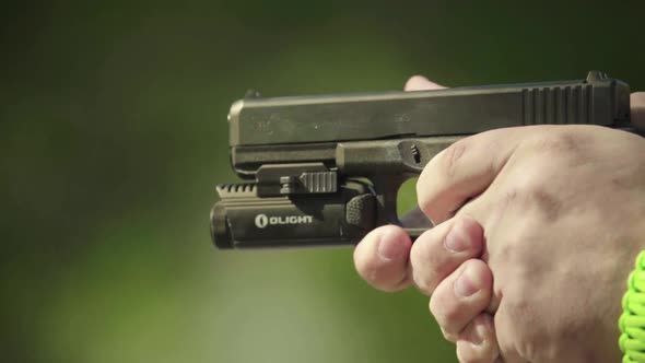 Close-up Shot of a Pistol. Slow Motion.