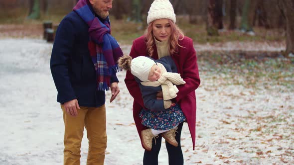 Young Family Walking in the Park