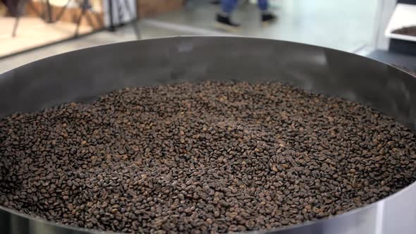 Grains of Roasted Coffee  Closeup Big Event Expo Roasting Machine