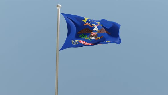 North Dakota flag on flagpole.