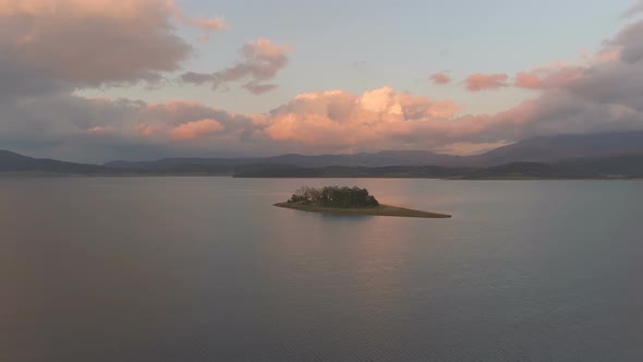 Sunset with Beautiful Red Clouds Over Lake with Calm Waters in Bulgaria