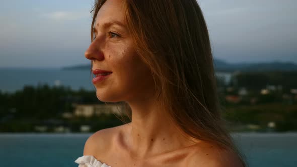 Close Up of Woman Face Looking at Sunset Relax and Deep Breathing on Rooftop