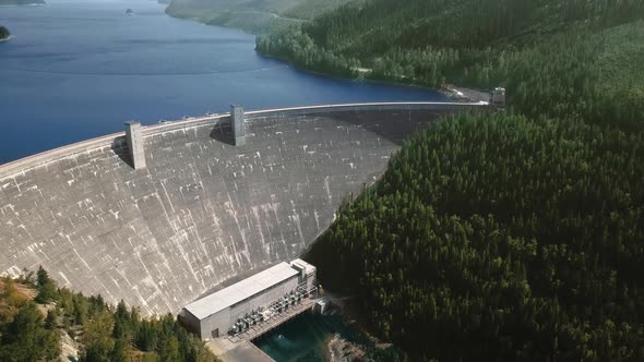 Drone camera shoots reservoir in front of a dam (Hungry Horse Dam, Flathead River, Montana, USA)