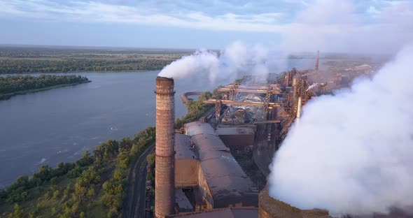 Aerial View of Industrial Zone with a Large Pipe Thick White Smoke