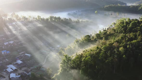 Aerial View of Sunrise with Fog Over Ban Rak Thai Chinese Village Near a Lake in Mae Hong Son