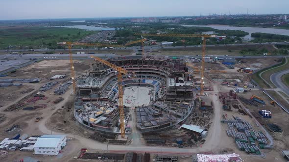 Assembled Arena Building and Cranes at Construction Site alt