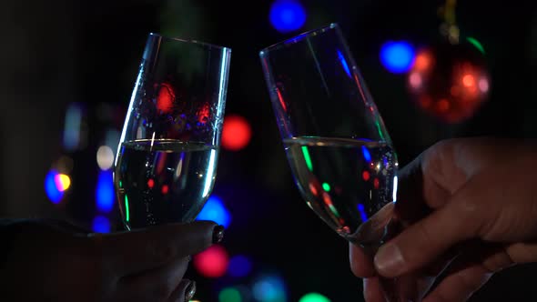 New Year Celebration with Two Clinking Champagne Glasses