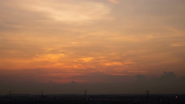 Time lapse sunset sunrise and beautiful twilight fluffy storm cloudy blue and yellow sky