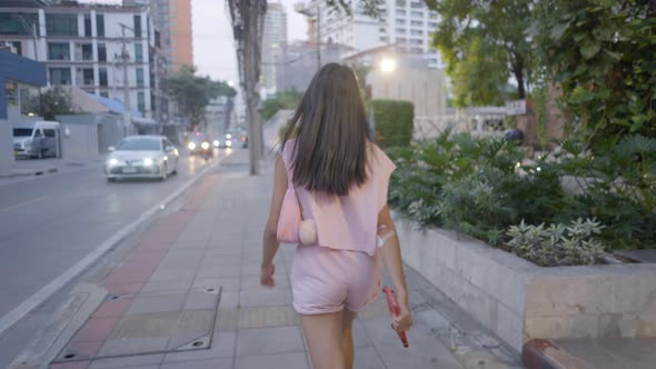 The Girl is Walking on the Road in Anger and the Camera is Following Her From Behind