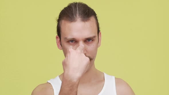 Caucasian Man with Serious View Gesturing to Pay Attention Over Yellow Background Isolated Closeup