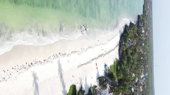 Vertical Video Boats in the Ocean Near the Coast of Zanzibar Tanzania Aerial View