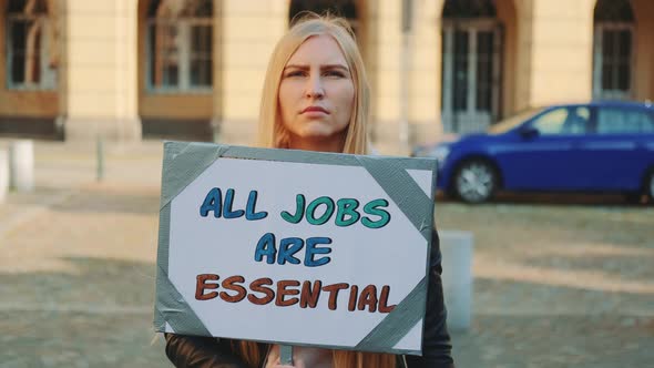 On Protest March Woman Drawing Attention To the Importance of All Kind of Jobs