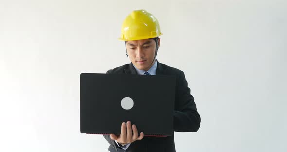 Asian Male Architect Working With Laptop Computer