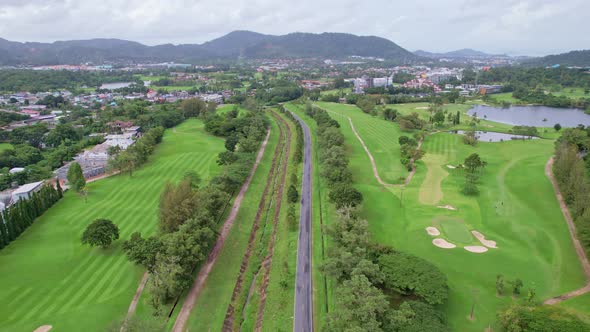 Aerial view Top down of the green golf course in Thailand Beautiful green grass and trees on a golf