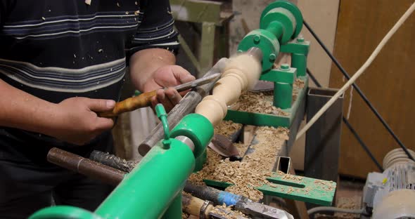 Carpenter turning wood on a lathe