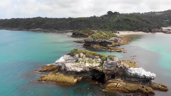 Aerial shot of beautiful islands on the blue ocean water of southern Australia.