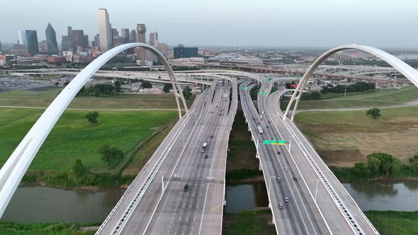 Aerial entering Dallas Texas over Margaret McDermott Bridge, interstate 30. Dallas skyline reveal.