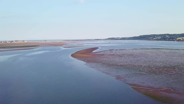 Lympstone bay, tide out, United Kingdom. Epic rising aerial view.