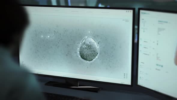 Scientist Performing Medical Sperm Analysis Via Innovative Software At A Medlab alt