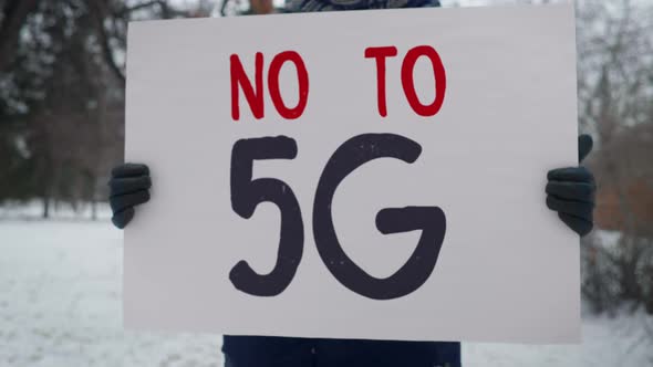 Person with a sign that says no to 5G. Protest against the use of 5G technology.